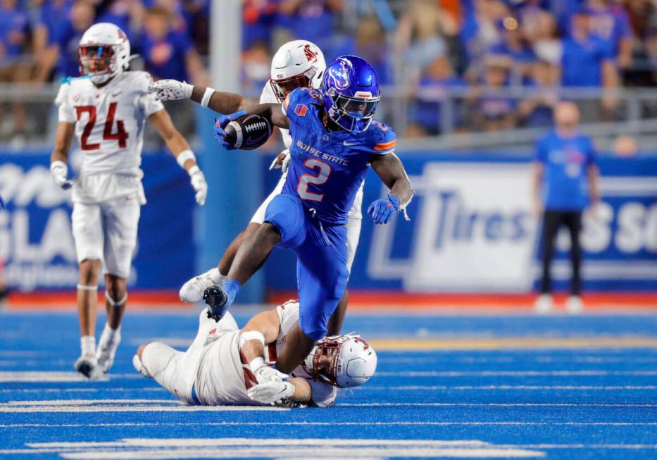 Boise State running back Ashton Jeanty (2) runs with the ball against Washington State in the s ...