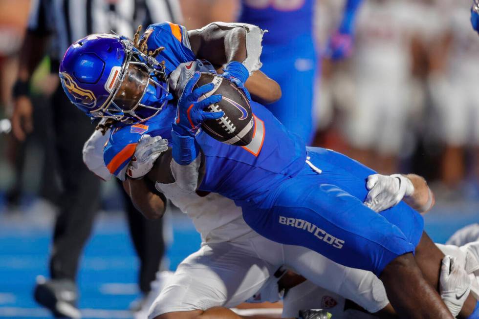 Boise State running back Ashton Jeanty (2) falls into the end zone on a 14 yard touchdown run a ...