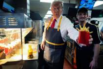 Republican presidential nominee, former U.S. President Donald Trump works behind the counter ma ...