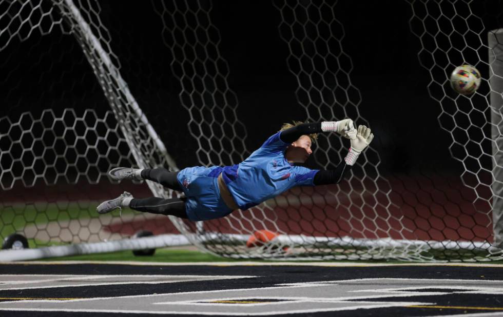 Palo Verde goalkeeper Landon Blanchard dives for a shot from Coronado that hit a goalpost durin ...