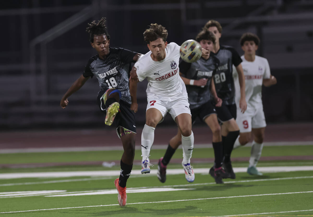 Palo Verde's Shilo Stephenson (18) kicks the ball past Coronado's Austin Kiernan (7) during a s ...