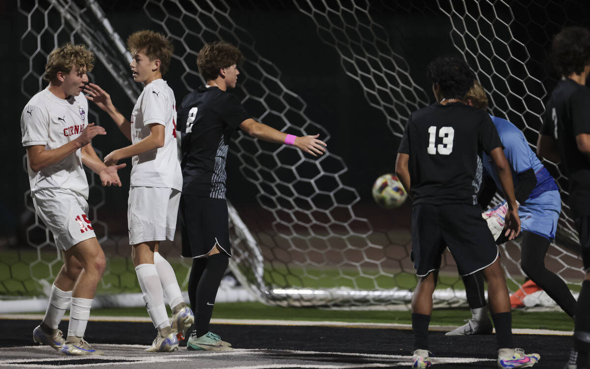 Coronado's defender Ben Aronow (15) and Coronado's midfielder Liam Bringhurst (12) celebradurin ...