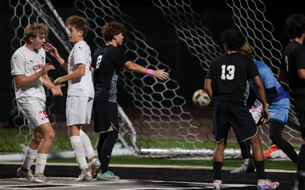 Coronado's defender Ben Aronow (15) and Coronado's midfielder Liam Bringhurst (12) celebradurin ...