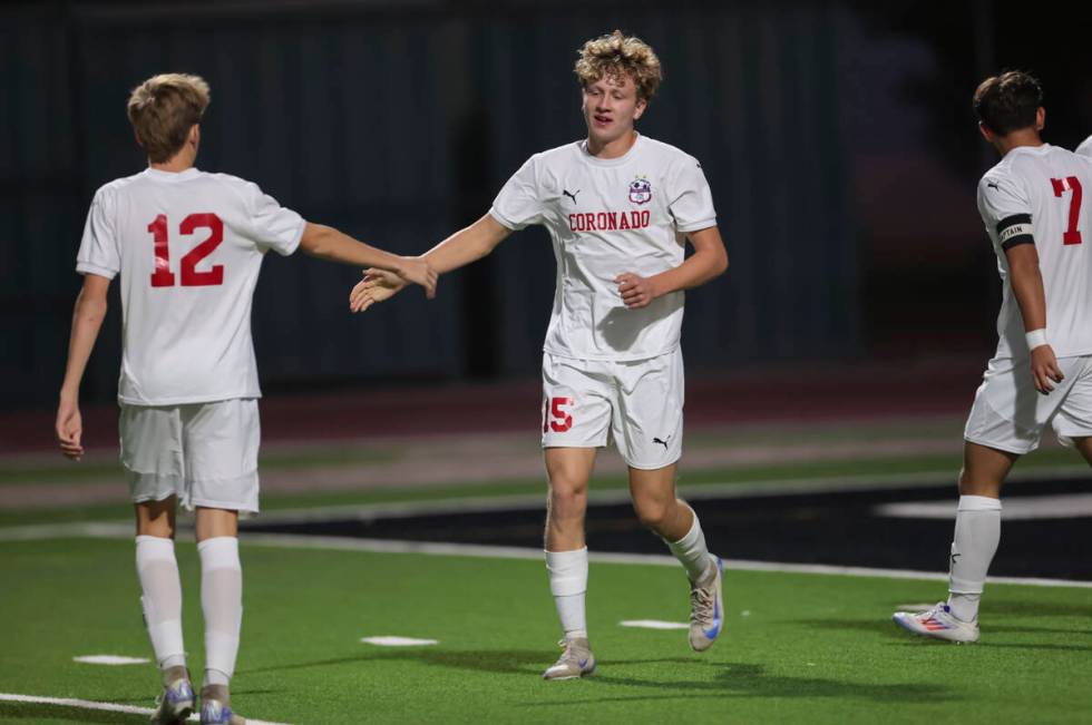 Coronado's Ben Aronow (15) celebrates his goal with Liam Bringhurst (12) during a soccer game a ...