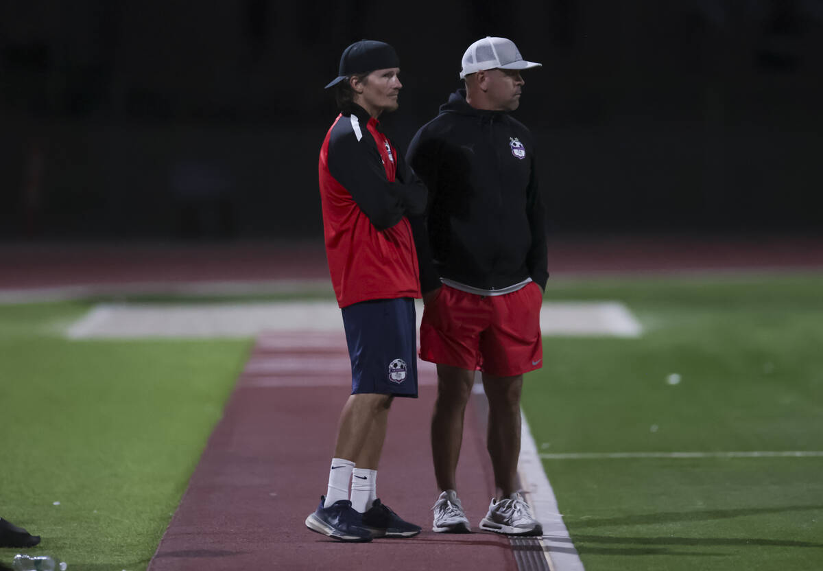 Coronado head coach Dustin Barton, left, looks on during a soccer game at Palo Verde High Schoo ...