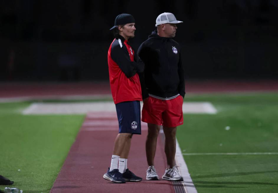 Coronado head coach Dustin Barton, left, looks on during a soccer game at Palo Verde High Schoo ...