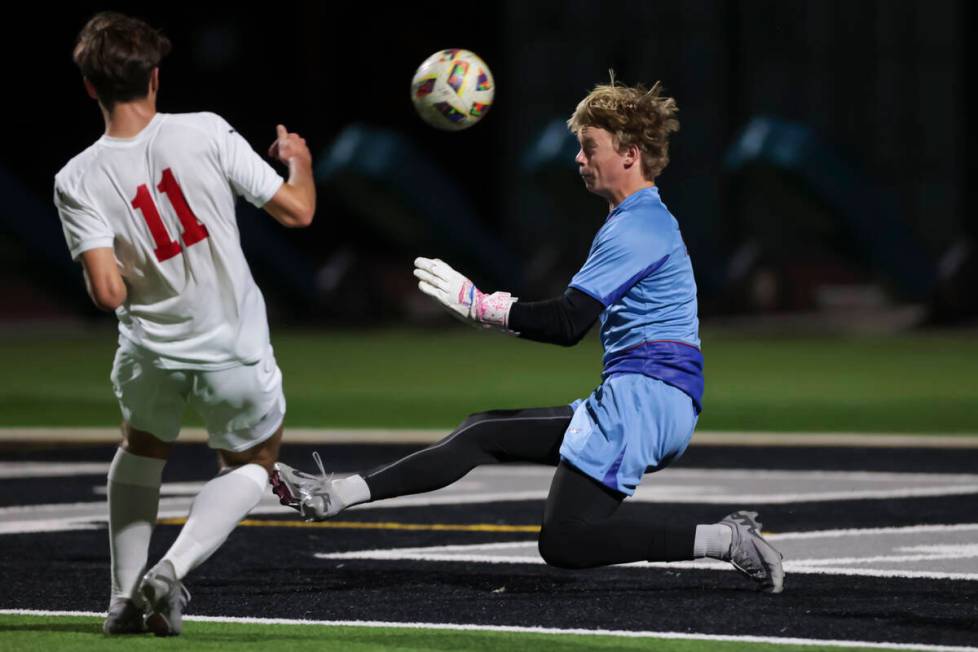 Palo Verde goalkeeper Landon Blanchard defends against a shot from Coronado's Gavin Flickinger ...