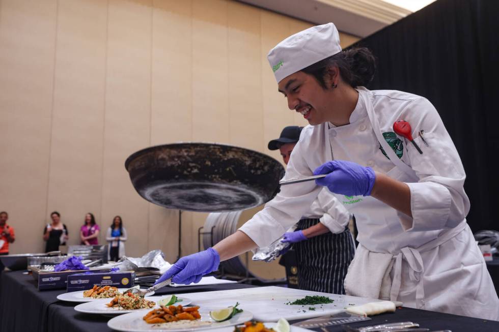 Prinz Villagracia, 17, from Rancho High School, plates his meal as he competes in the School Me ...