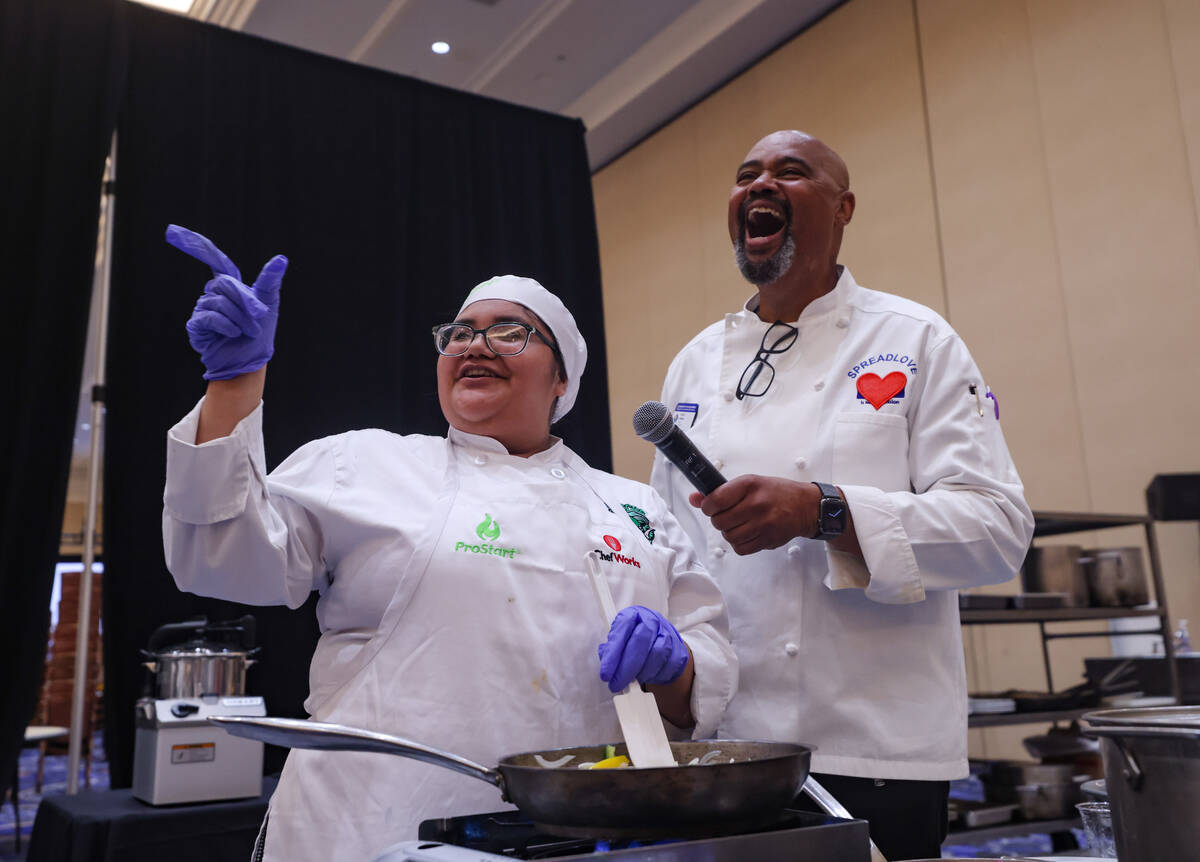 Monse Valencia, 17, from Rancho High School, speaks with host and Chef Curtis Aiken as she comp ...