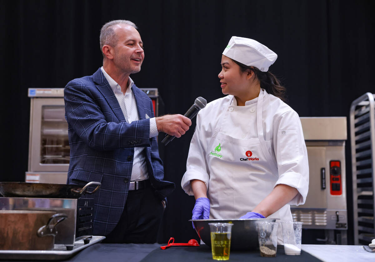 Gabriela Lim, 15, from Silverado High school, speaks with Rob Bisceglie, CEO of Action for Heal ...