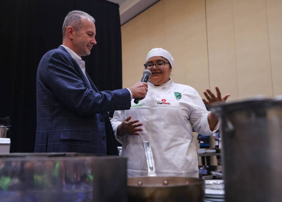 Monse Valencia, 17, from Rancho High School, speaks with Rob Bisceglie, CEO of Action for Healt ...