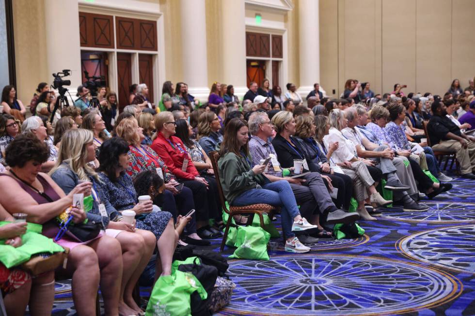 The audience watches local high school students compete in the School Meal Cooking Challenge at ...