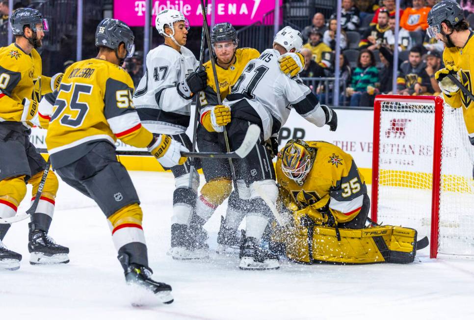 Golden Knights goaltender Ilya Samsonov (35) secures another puck as Los Angeles Kings center T ...