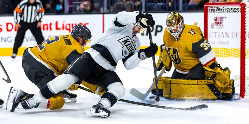 Los Angeles Kings goaltender David Rittich (31) attempts to get the puck past Golden Knights go ...