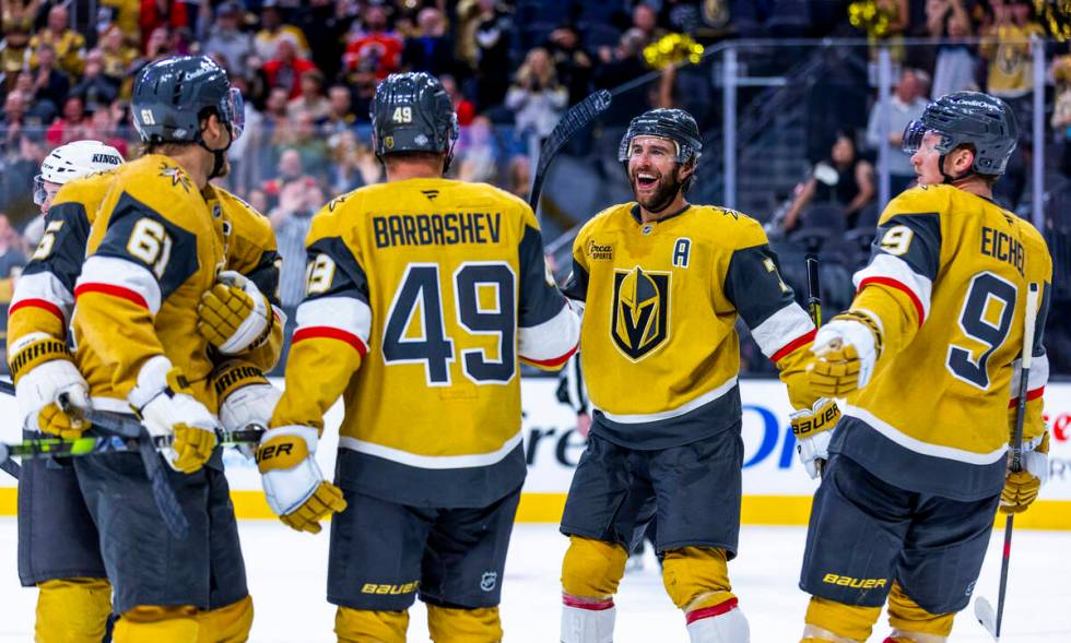 Golden Knights players celebrate a sixth goal against the Los Angeles Kings during the third pe ...