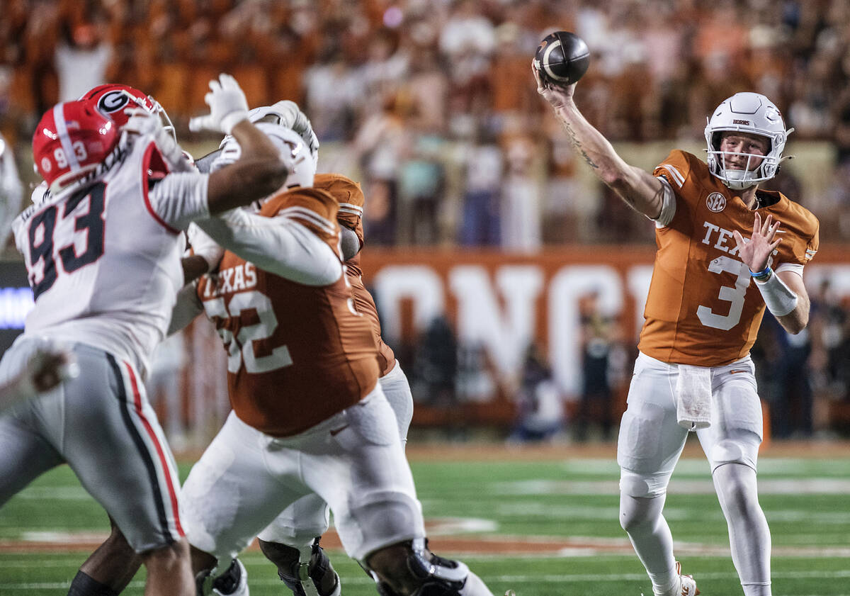 Texas quarterback Quinn Ewers (3) passes against Georgia during the second half of an NCAA coll ...