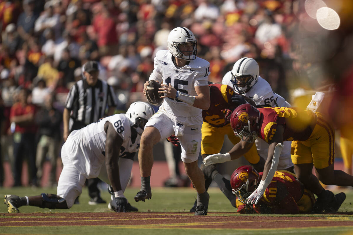 Penn State quarterback Drew Allar (15) runs with the ball during an NCAA football game against ...