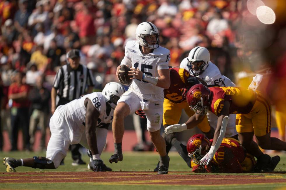 Penn State quarterback Drew Allar (15) runs with the ball during an NCAA football game against ...