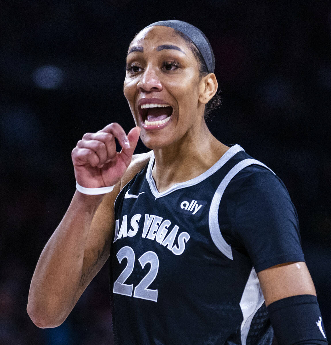 Aces center A'ja Wilson (22) yells about being fouled on the drive by Seattle Storm guard Jorda ...