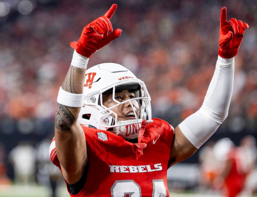 UNLV defensive back Kodi DeCambra (24) pumps-up the crowd after a punt during the college footb ...