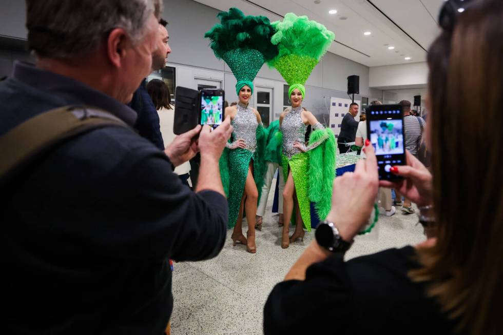 Showgirls pose for photographs following Air Lingus’ first nonstop flight from Dublin to ...