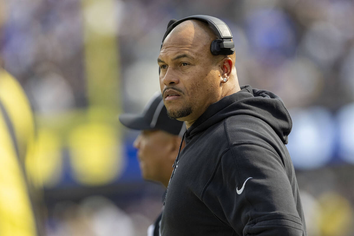 Raiders head coach Antonio Pierce watches from the sideline during the first half of an NFL gam ...