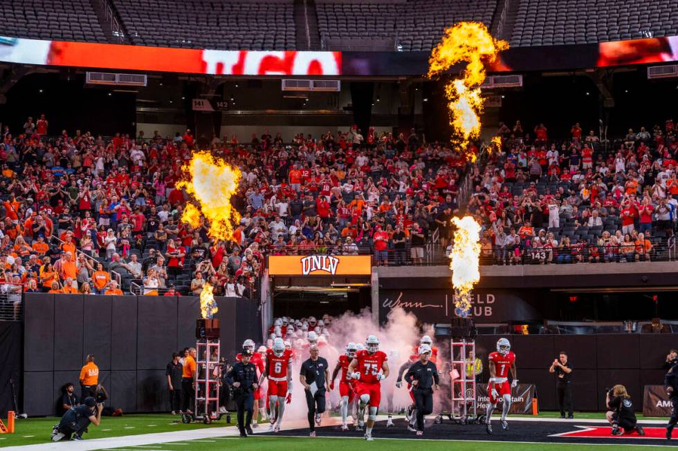 UNLV emerges from the tunnel onto the field to take on the Syracuse Orange during the first hal ...