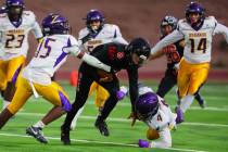 Las Vegas quarterback Tanner Vibabul (8) goes down with the ball as Durango defense closes in d ...