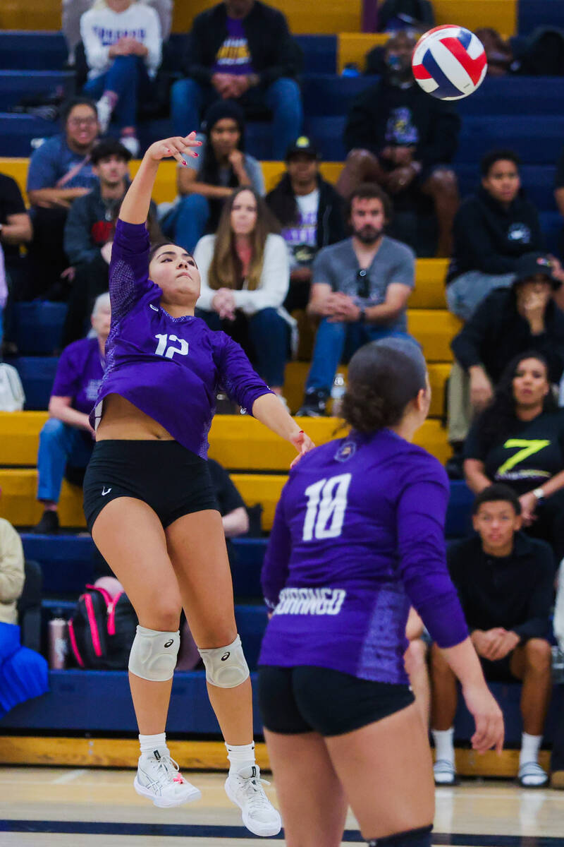 Durango outside hitter Angelina Guerrero (12) jumps to hit the ball over the net during a volle ...