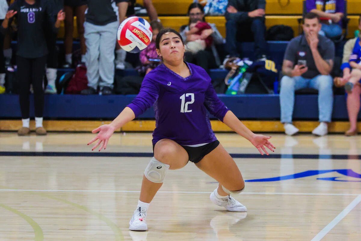 Durango outside hitter Angelina Guerrero lunges for the ball during a volleyball match between ...