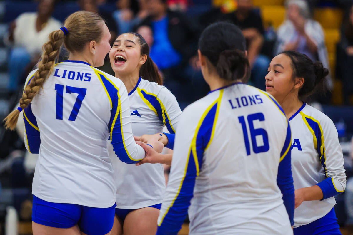 Sierra Vista setter Angelina DeGrange (second from left) celebrates with her teammates during a ...