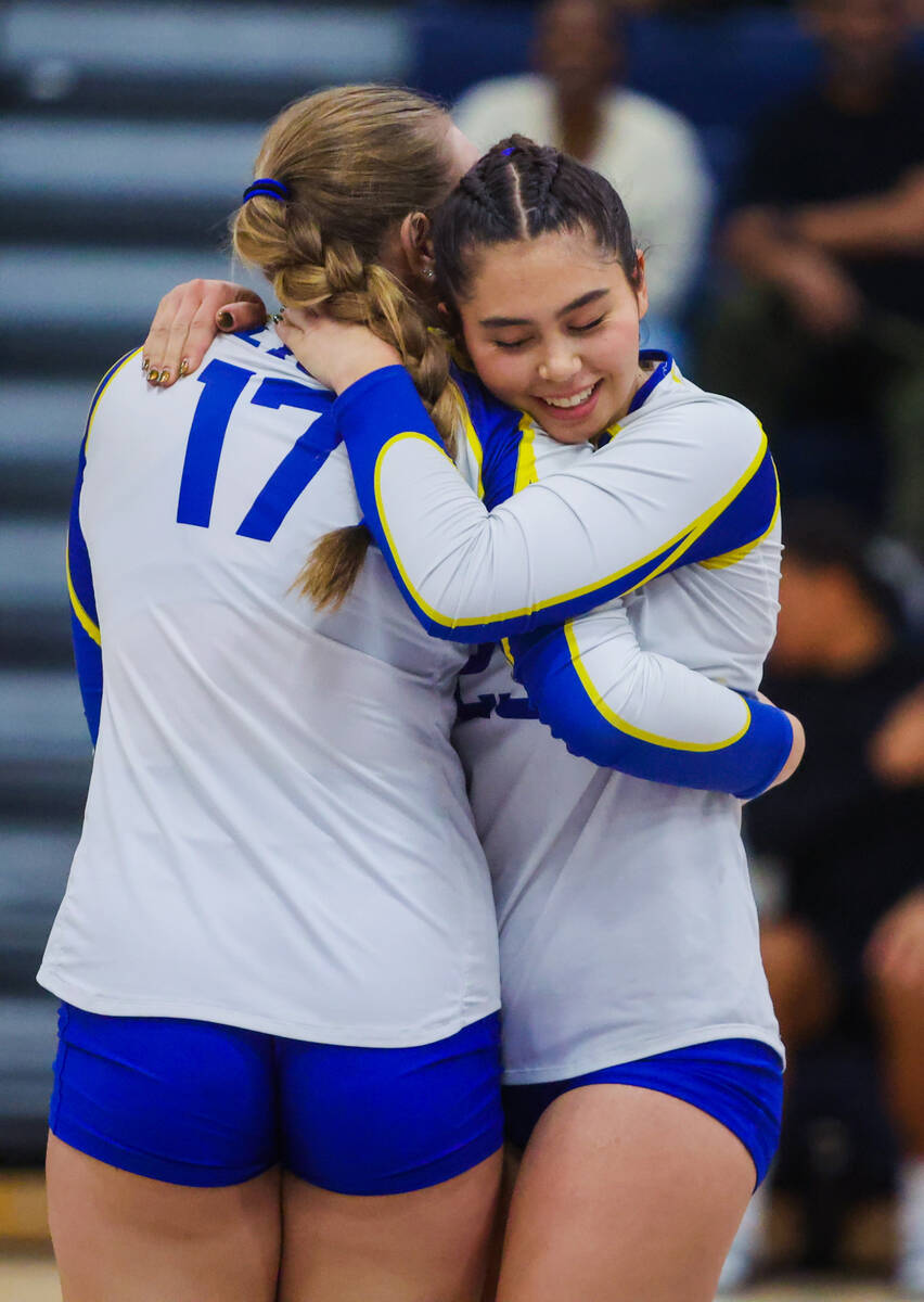 Sierra Vista setter Angelina DeGrange (23) hugs teammate Gabriella Frey (17) during a volleybal ...