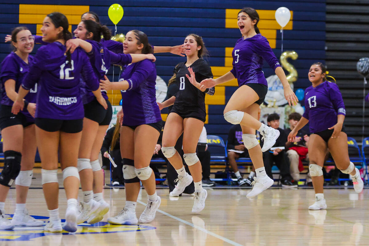 Durango teammates celebrate winning a volleyball match against Sierra Vista at Sierra Vista Hig ...