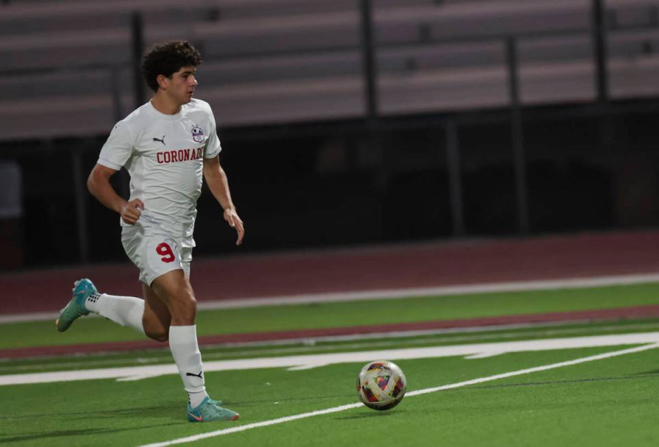 Coronado's Dylan Flores brings the ball up the field during a soccer game at Palo Verde High Sc ...