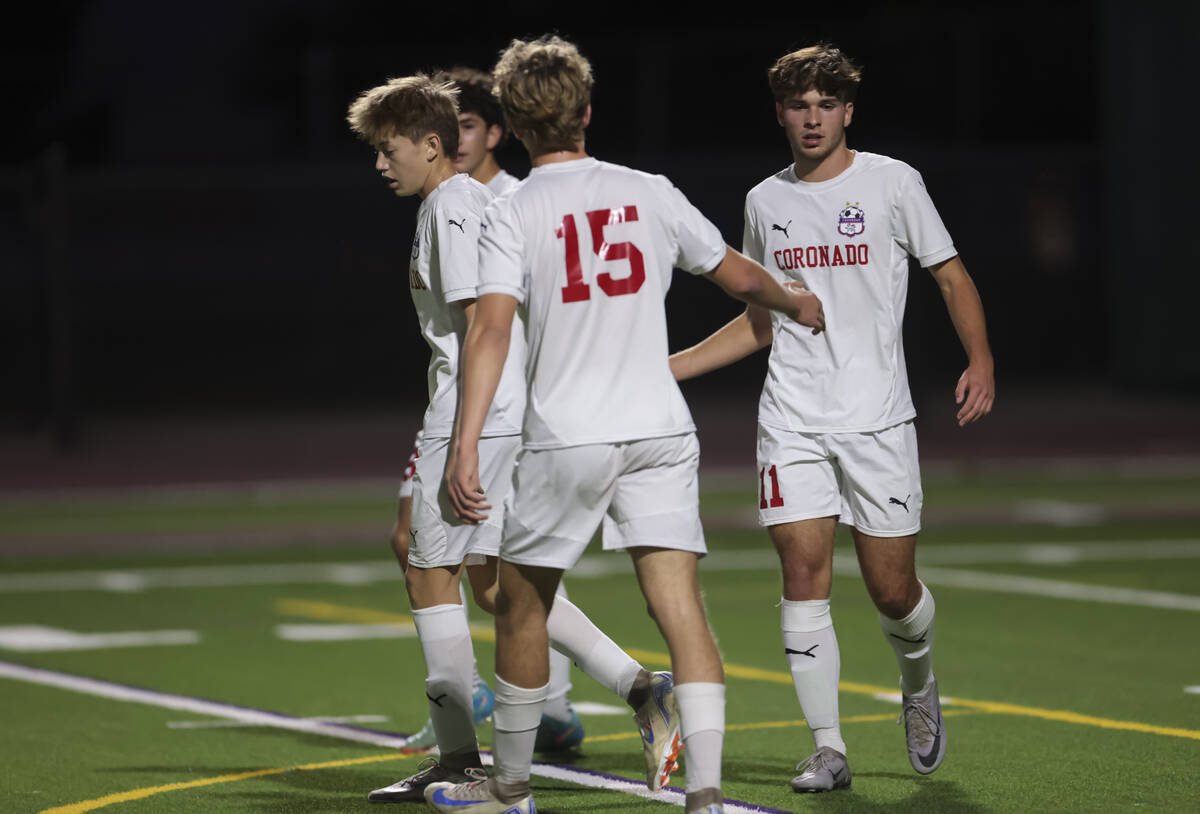 Coronado's Gavin Flickinger, right, celebrates the team’s goal during a soccer game at P ...