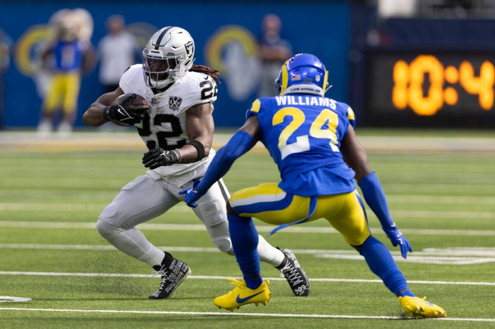 Los Angeles Rams cornerback Darious Williams (24) looks to tackle Raiders running back Alexande ...