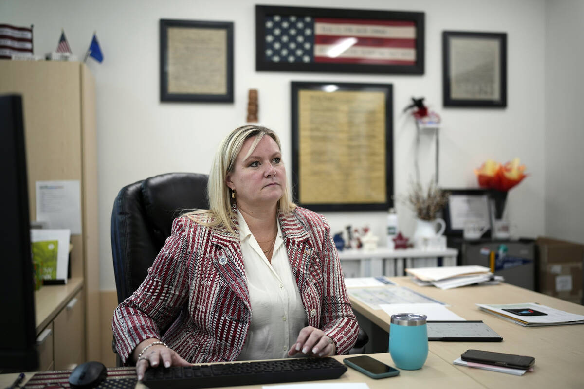 Cari-Ann Burgess, interim Registrar of Voters for Washoe County, Nev., sits in her office Sept. ...