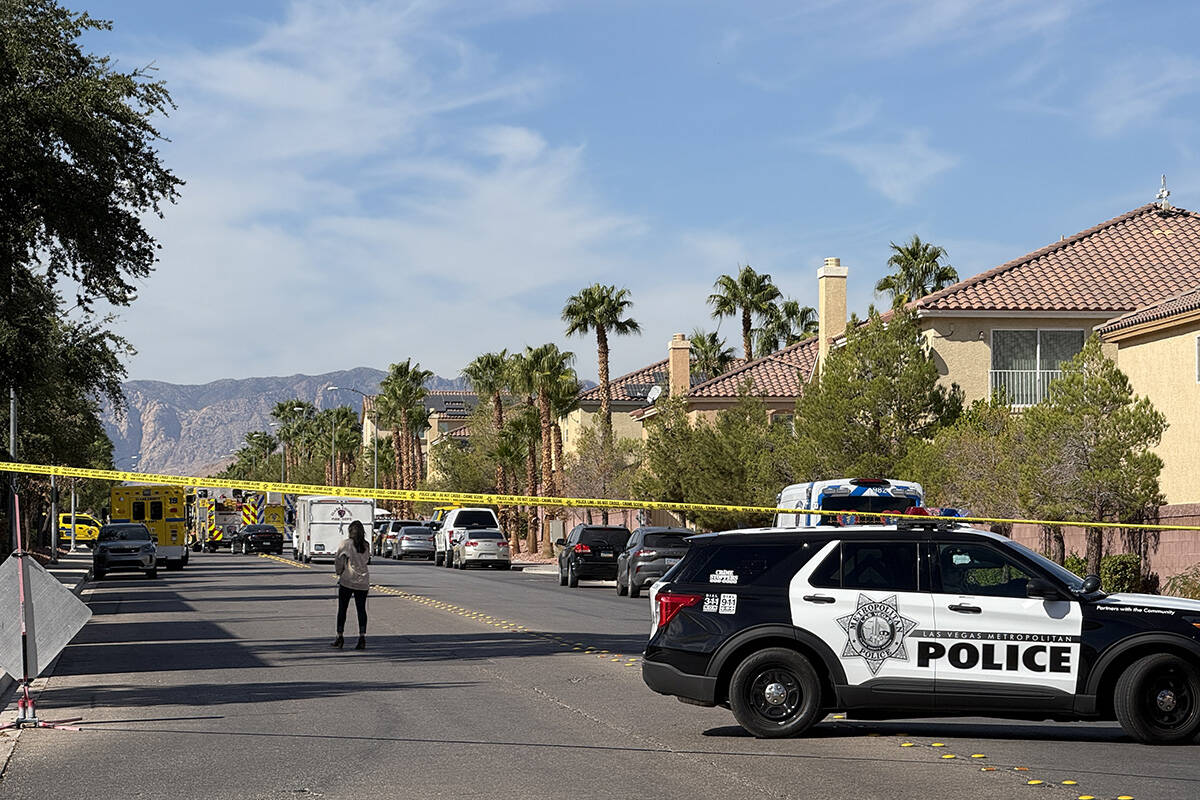 Police block a street after a house fire Thursday, Oct. 24, 2024, on the 8300 block of Langhorn ...