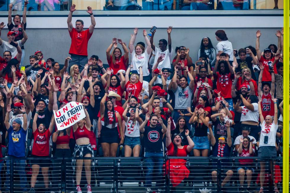 UNLV fans cheer as they blow out Fresno State Bulldogs during the second half of their NCAA foo ...