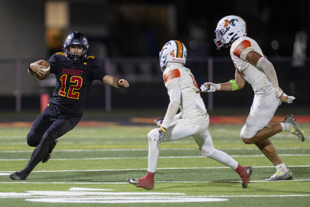 Losee senior RJ Olivieri (12) begins to slide during the high school 4A Desert League title foo ...