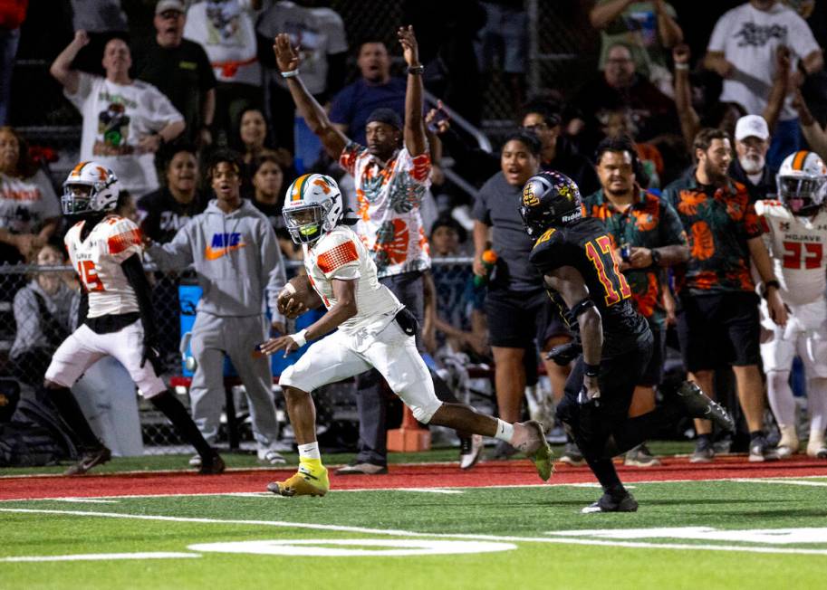 Mojave senior Antwan Hawkins (7) runs the ball for a huge gain during the high school 4A Desert ...