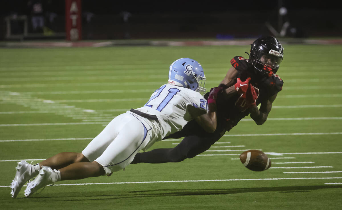 Centennial’s Domonique Vaughn (21) breaks up a pass intended for Las Vegas' Mychael Walk ...