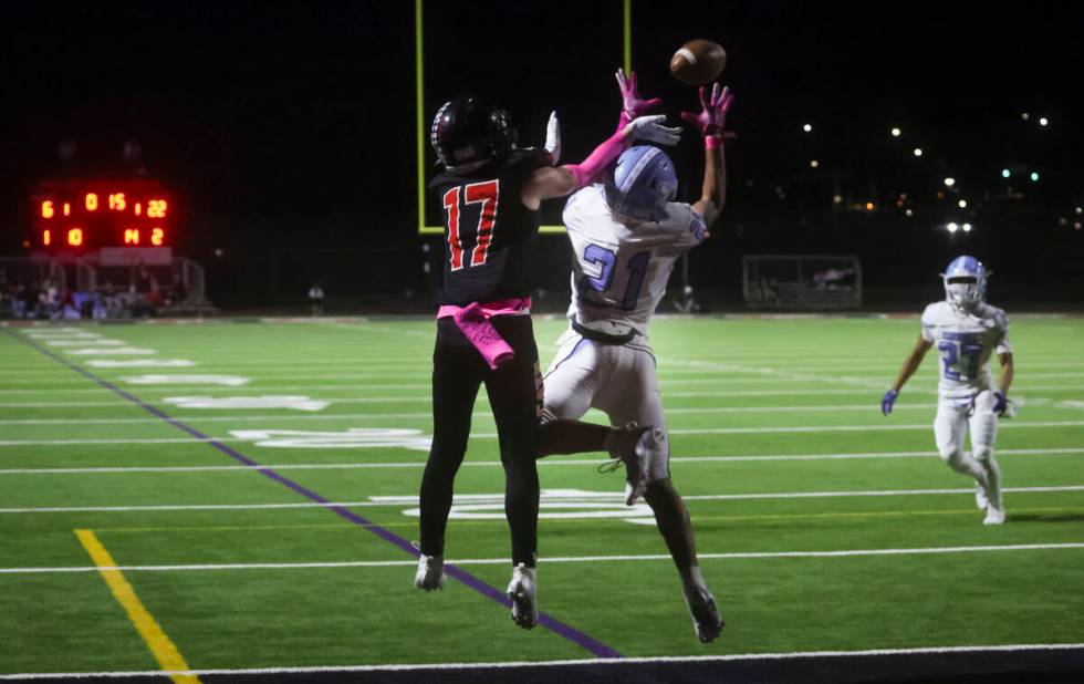 Centennial's cornerback Domonique Vaughn (21) intercepts a pass intended for Las Vegas' wide re ...