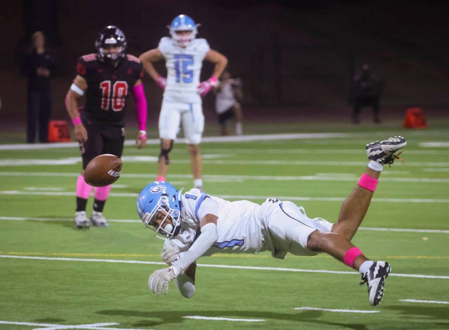 Centennial's Jayden Thomas (1) comes up short ton a pass during a football game at Las Vegas Hi ...