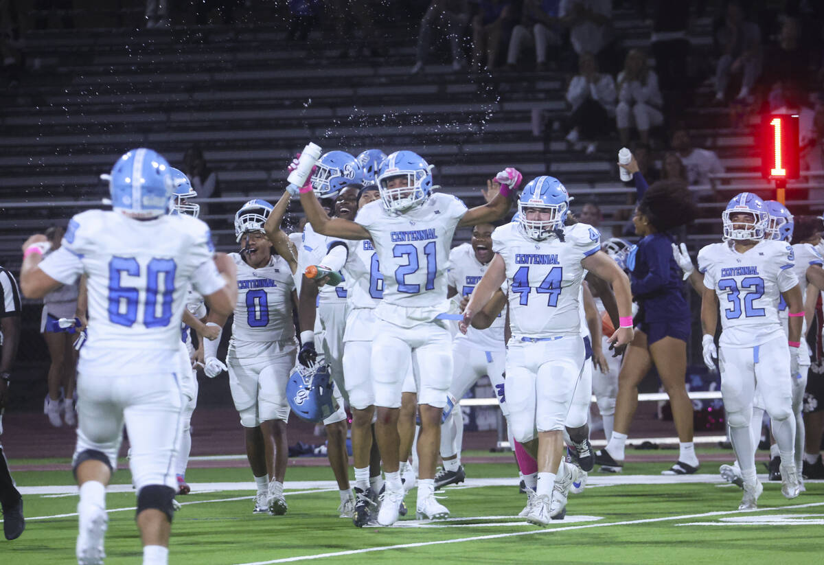 Centennial players celebrate after defeating Las Vegas in a football game at Las Vegas High Sch ...