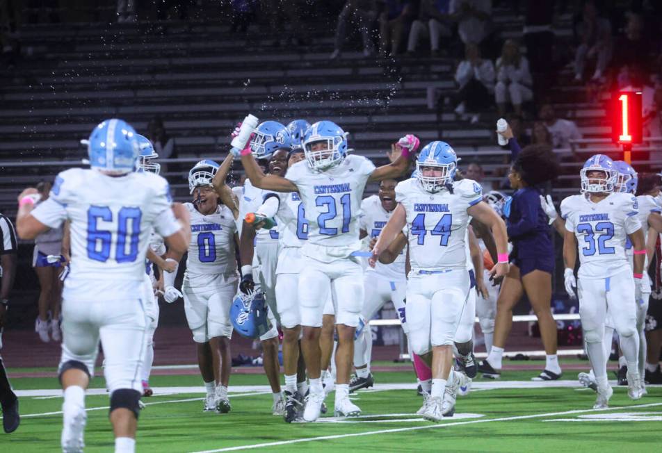 Centennial players celebrate after defeating Las Vegas in a football game at Las Vegas High Sch ...