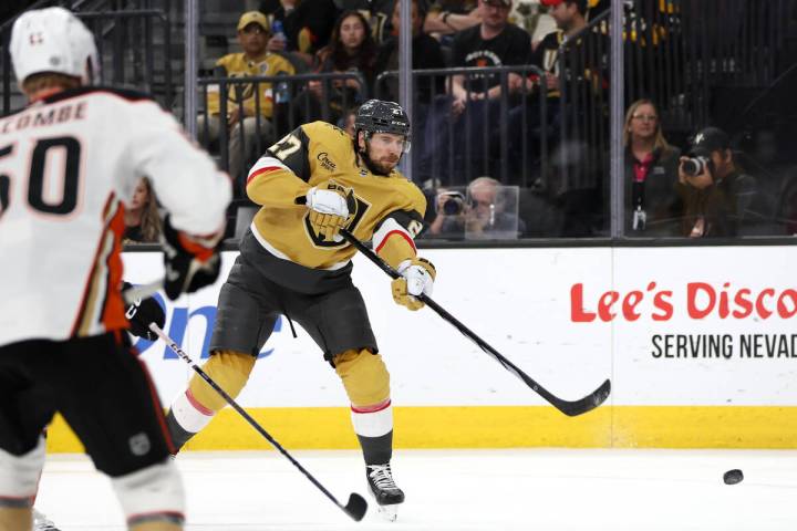 Golden Knights defenseman Shea Theodore (27) attempts a goal during the third period of an NHL ...