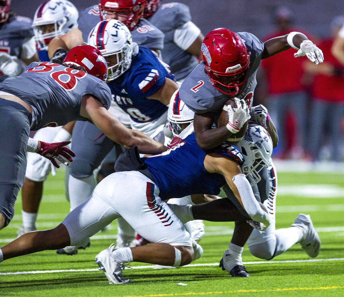 Arbor View's running back Sean Moore (2) battles for yards against Liberty during the first hal ...