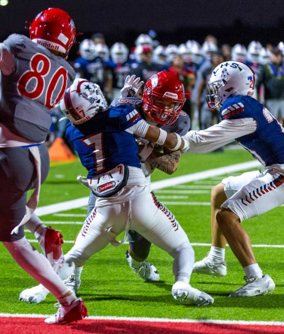 Arbor View wide receiver Jayden Williams (6) battles against Liberty defender Gravis Lopez (7) ...