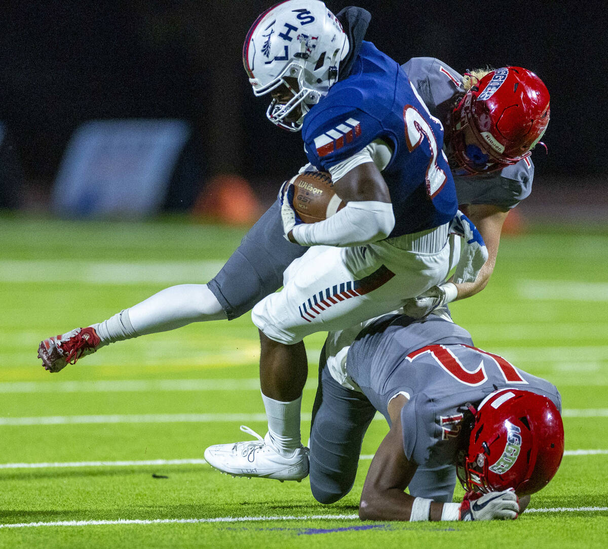 Liberty running back Taleni Liua (20) is tackled by Arbor View safety Jordan Hales (1) during t ...